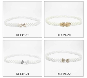 Detail view of double-row pearl elastic belts with assorted floral and bow buckles