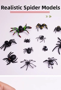 Macro detail of realistic Halloween toy spiders with colorful patterns on white surface