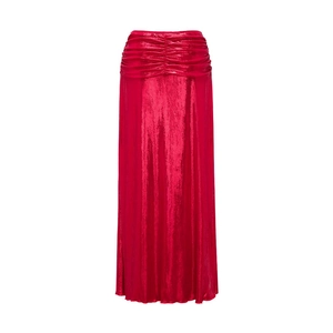 Detail showing the ruched waist design and shiny metallic red fabric of the long skirt