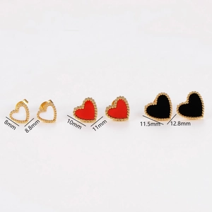 Three pairs of heart stud earrings in white red and black enamel with gold metal frames