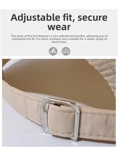 Detailansicht der verstellbaren Metallschnalle und des Stoffbands an der beigen Baseballkappe