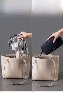 Detail showing contrast between messy cables and organized digital accessory bag storage