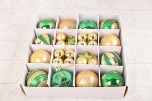 Detail of 42-piece green and gold Christmas ball ornaments set in a white gift box