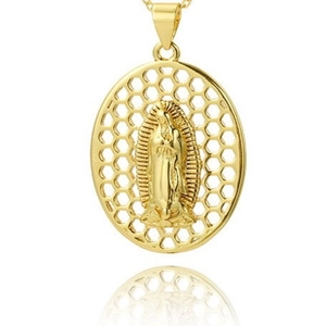 Macro detail of gold-plated Virgin Mary pendant with intricate honeycomb texture