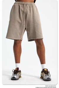 Detail of vintage washed brown cotton shorts showing the drawstring waist and relaxed fit