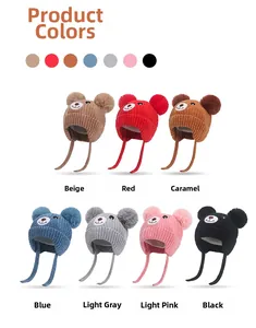 Detailed grid of knitted baby hats with double pompoms and bear embroidery in seven colors