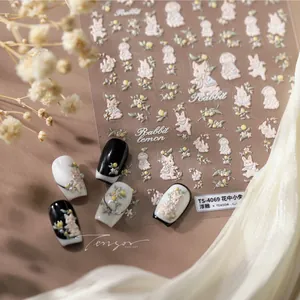 Detail of 3D embossed nail stickers featuring cute rabbits and lemon patterns