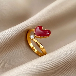 18k gold plated open heart ring with red enamel and zircon on champagne silk background