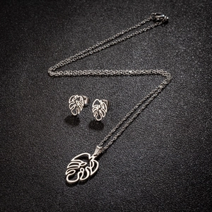 Silver stainless steel jewelry set with hollow palm leaf necklace and earrings