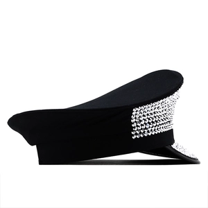 Detail of black military flat top hat adorned with shimmering silver rhinestones