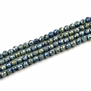 Macro detail of faceted agate beads with metallic druzy texture and blue gold luster
