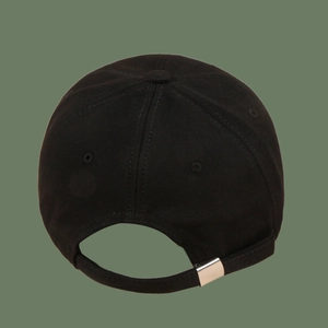 Detail view of black cotton baseball cap showing back with adjustable silver metal buckle