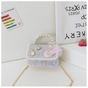 Detail of sequins handbag with pearl handle, pink swan patch and gold chain strap