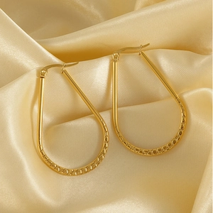 French vintage style 18K gold plated oval hoop earrings with embossed texture on silk fabric