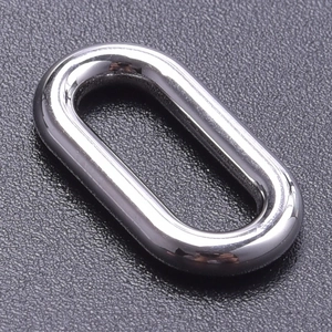 Macro shot of polished silver stainless steel oval D-ring connector for DIY jewelry