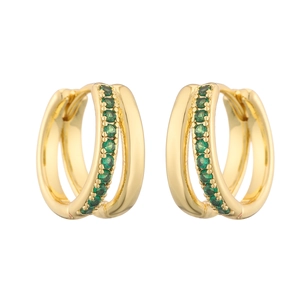 Detail of gold huggie earrings with double-layer structure and emerald green gemstones