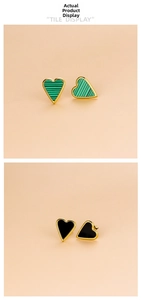 Detail of heart earrings with green malachite and black onyx in gold-plated settings