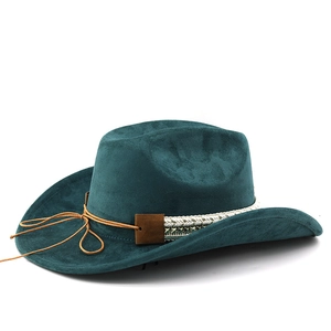 Detail of teal suede cowboy hat featuring white woven band and brown cord accents