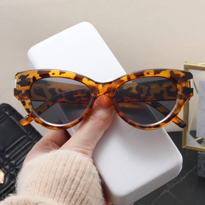 Close-up of vintage cat-eye sunglasses with tortoiseshell frames and metal accents