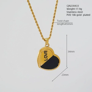Detailed view of bicolor heart pendant with LOVE engraving and 450mm twist chain
