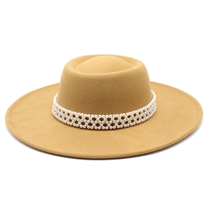 Detail of wool felt fedora hat featuring an elegant white pearl beaded headband trim