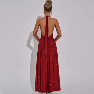 Detail of elegant backless halter dress with sparkling fabric and deep red sequins