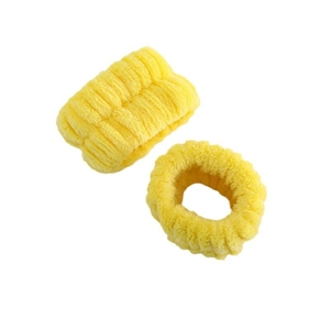 Close-up of bright yellow coral fleece wristbands showing soft absorbent plush texture