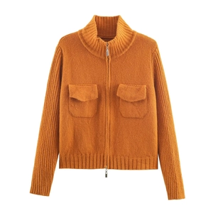 Bright orange chunky knit cardigan with high neck, metal zip, and large flap pockets