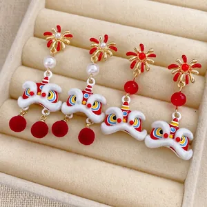 Traditional Chinese lion dance earrings with velvet texture and pearls in a jewelry box