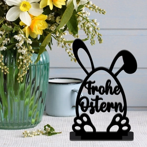Detail of black acrylic Easter egg stand with Frohe Ostern hollow design and base