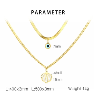 Detail of layered gold snake chain with blue evil eye and fan shell pendants