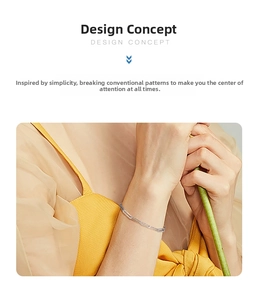 Detail of minimalist S925 sterling silver paperclip bracelet on a female wrist