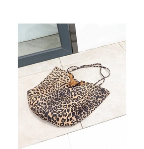 Detailed view of large leopard print tote bag with soft fabric and durable shoulder straps