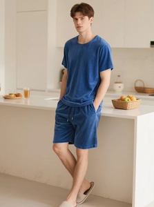 Deep blue velvet loungewear set detail showing soft texture and modern drawstring shorts