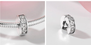 Detail of S925 sterling silver clip charm with square cubic zirconia on snake chain
