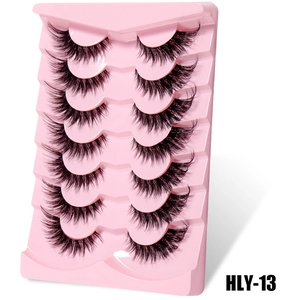 Macro shot of 7 pairs of thick flared false eyelashes on a pink tray, style HLY-13