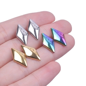 Detailed view of six rhombus stainless steel earrings in gold, silver, and iridescent finishes