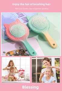Detail of cute cat-ear hair brushes with vibrant pink-green and green-yellow gradients