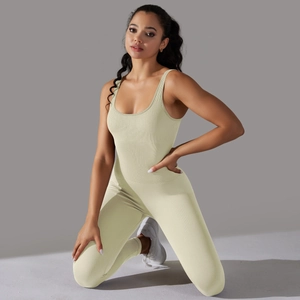 Detail of cream beige ribbed yoga jumpsuit showing seamless fabric texture and fit