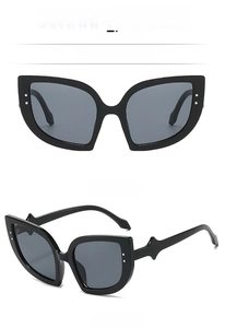 Front and 45-degree side view of classic black cat-eye sunglasses with large frames