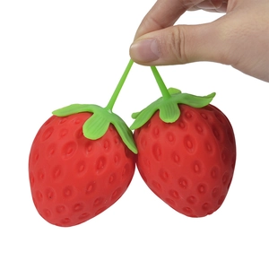 Realistic double strawberry squeeze toy with green stems for stress relief