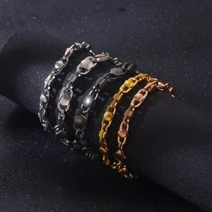 Detail of titanium steel curb chain bracelets in silver, grey, gold and rose gold finishes