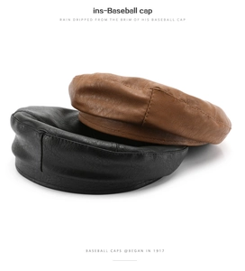 Close-up of black and brown leather octagonal beret hats with detailed stitching