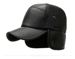 Detail view of black leather winter hat featuring fold-down earflaps and side metal eyelets