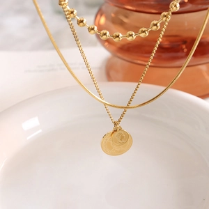 Three-layer gold layered necklace with Elizabeth II coin pendant and OT toggle clasp