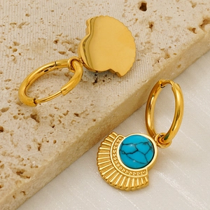 Bohemian gold fan-shaped earrings with turquoise stones in a minimalist vintage style