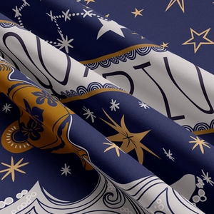 Macro shot of star-themed tapestry fabric showing detailed texture and artistic patterns