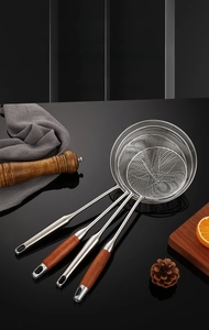 Detail of 304 stainless steel wire skimmer spoons with ergonomic wooden and metal handles
