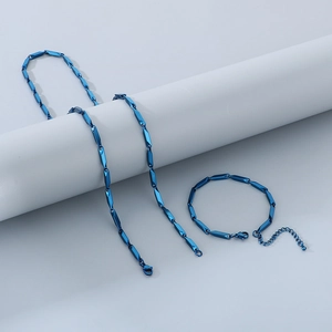 Blue stainless steel bamboo link necklace and bracelet jewelry set for men on gray background