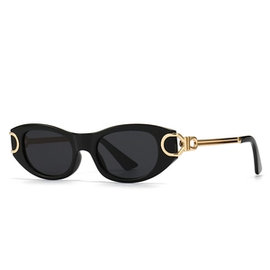 Modern punk oval sunglasses with black frames and gold metal temples for women